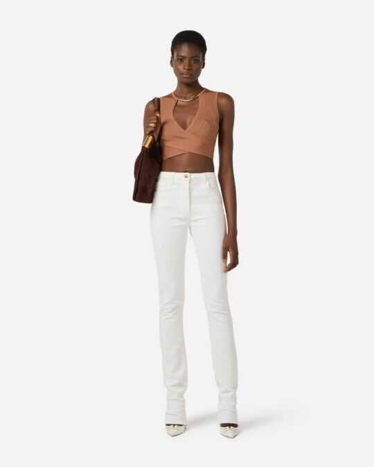 Pantalón denim pitillo con candado joya